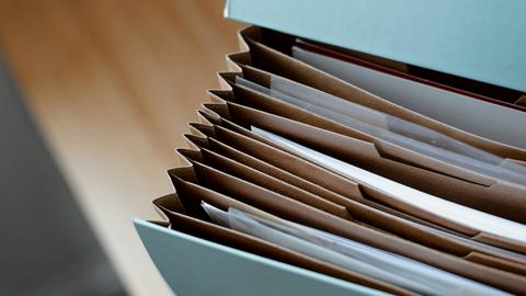 Accordian file folder holding paper files
