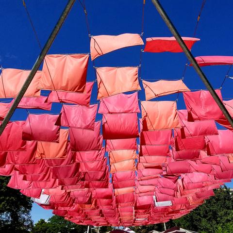 Flags fluttering in Blue sky background