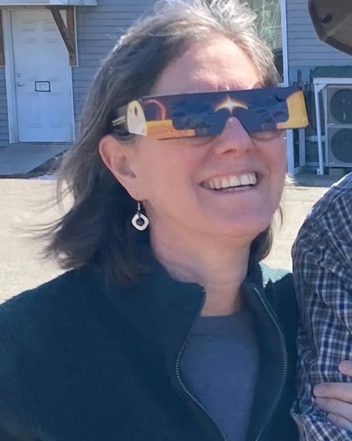 Lauren Hammer wearing eclipse glasses