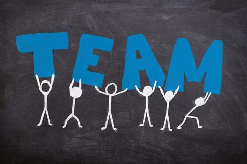 stick figures holding up the word TEAM